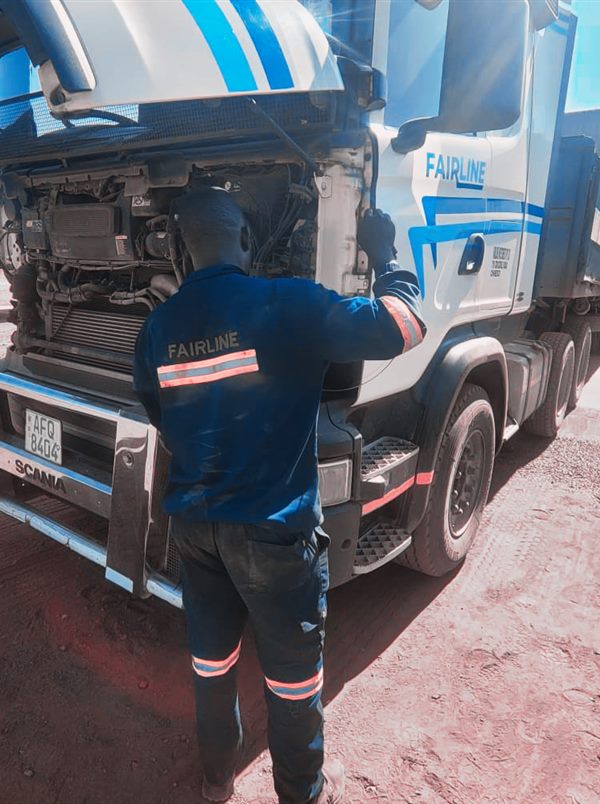 Fairline workshop technician repairing a truck